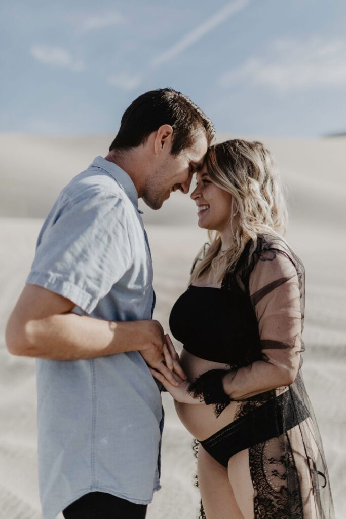 couple looking at each other with foreheads together in desert by katherine krakowski photography a lake tahoe reno photographer