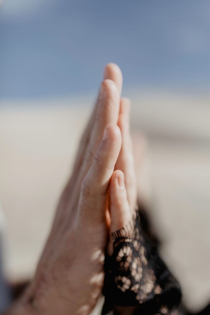 close up photo of couples hands in desert by katherine krakowski photography a lake tahoe reno photographer