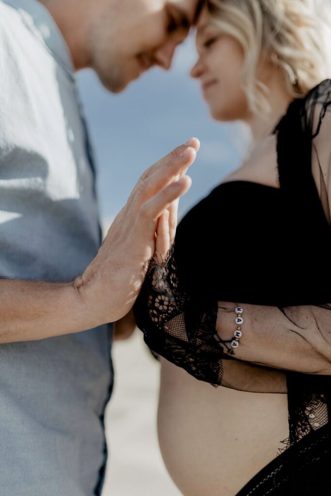 close up photo of couples hands in desert by katherine krakowski photography a lake tahoe reno photographer