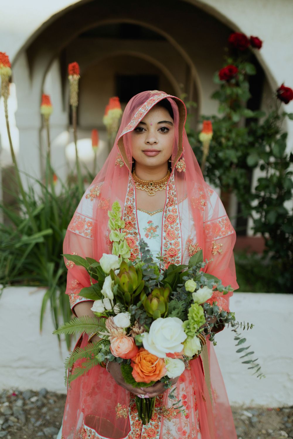 indian bride holding bridal bouquet from galena forest flowers at steamboat hotsprings in reno nevada taken by katherine krakowski photographer