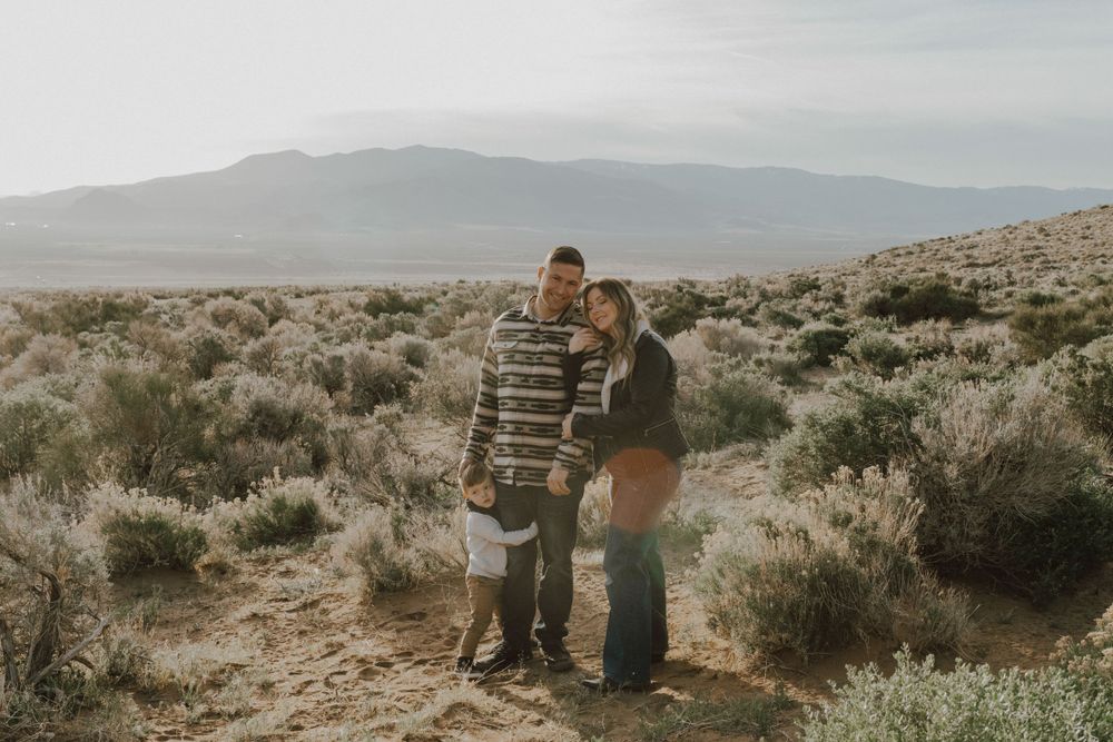 family of three with son holding each other in northern nevada desert taken by lake tahoe reno photographer katherine krakowski photography